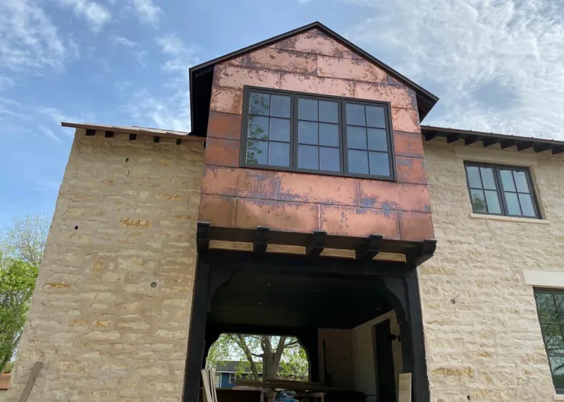 Copper metal panel facade on a stone building for Skylight Installation in Fallston